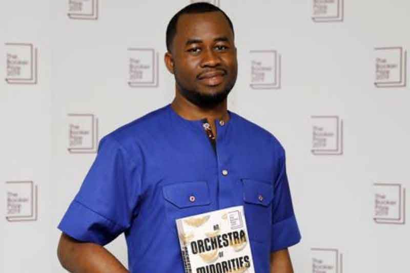 Author Chigozie Obioma with his book - An Orchestra of Minorities