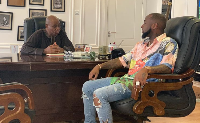 Davido's father Adeleke haveing a conversation with him