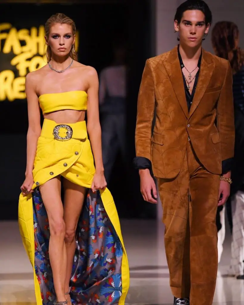 Paris Brosnan and another model walking the runway