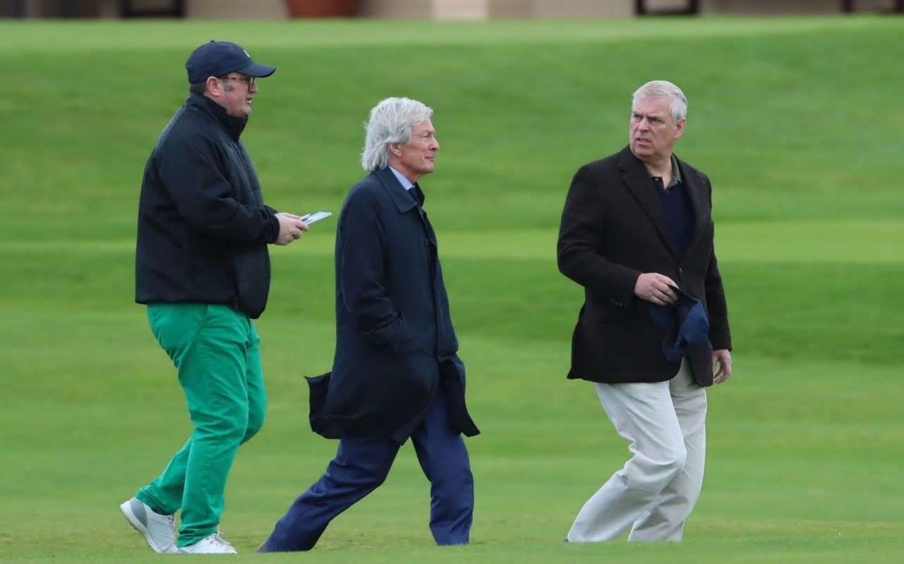 Prince ndrew abd Paul Tweed on golf course in Northen Ireland