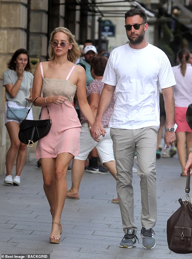 Jennier Lawrence with her now-husband photographed walking in public