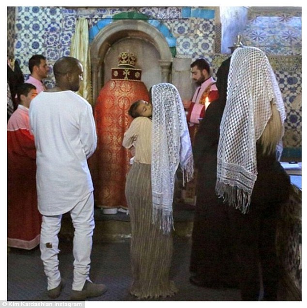Kanye West, Kim during her baptism