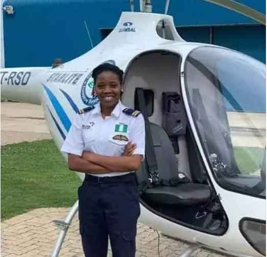 Tolulope Arotile posing with her  helicopter