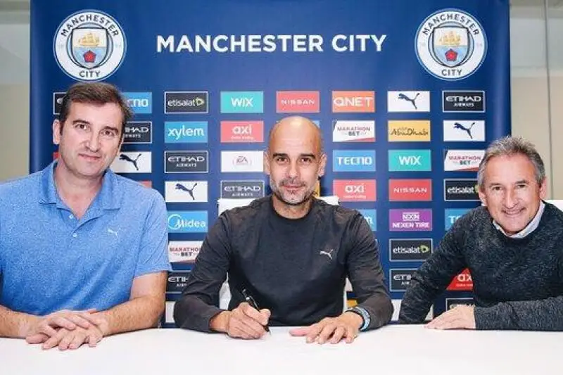 Pep Guardiola signs new deal
