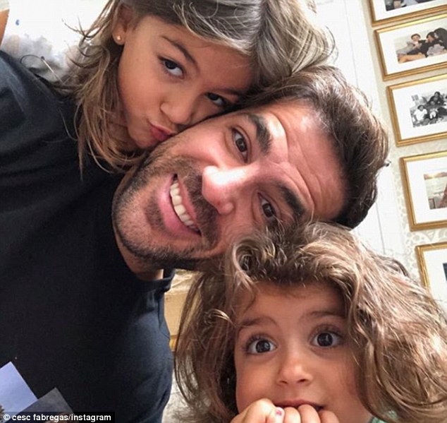 Chelsea midfielder Cesc Fabregas takes a selfie with his two daughters Lia and Capri