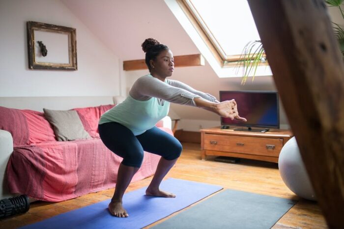 A Woman Doing setbacks while Stretching Her Arms