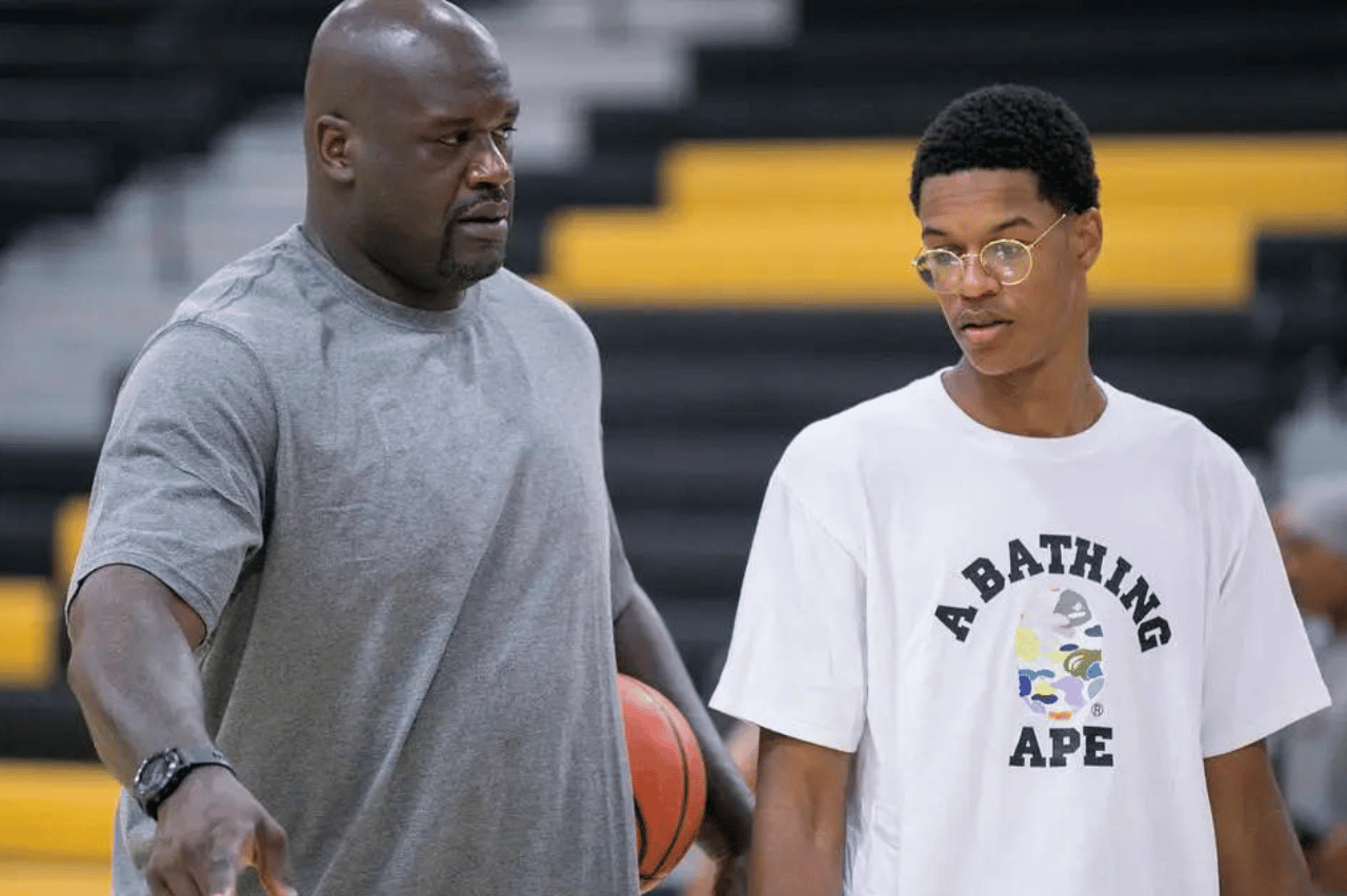 Shareef O'Neal, right is coached by his dad Shaquille O'Neal, left, during a team practice.