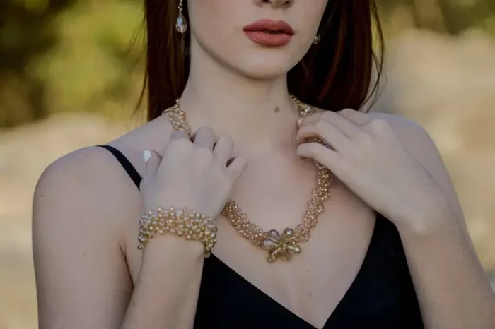 Woman Touching Gold Jewelry