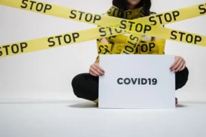 Woman Holding covid-19 Sign