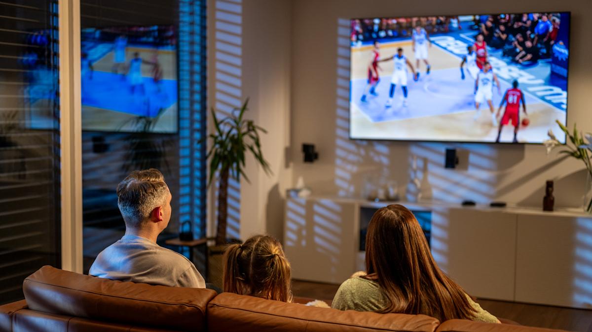 Smart TV displaying various sports streaming service options in a modern living room