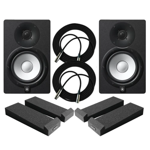 Yamaha studio monitors on isolation pads flanking a DAW screen with acoustic panels behind
