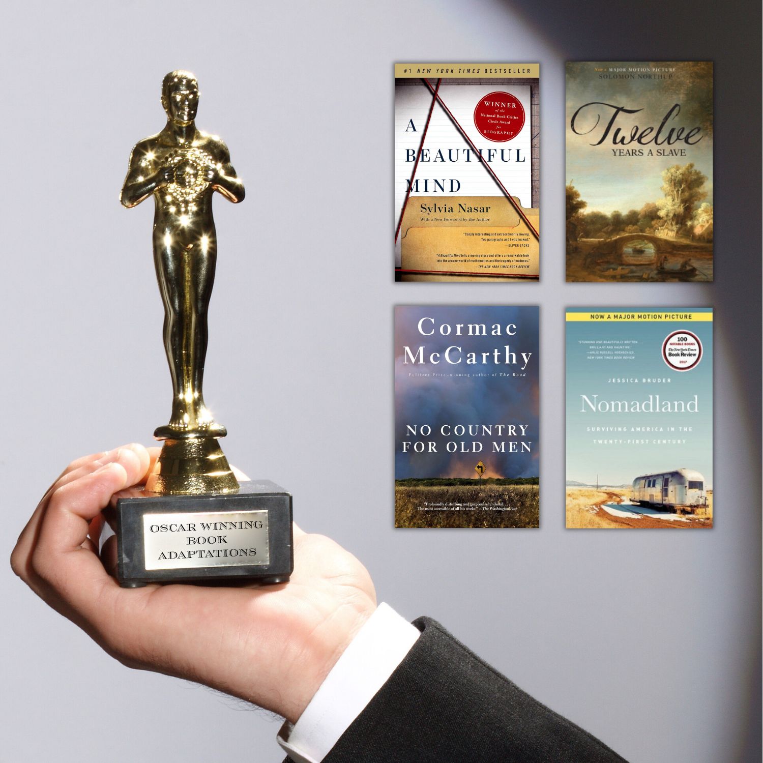 Stack of bestselling novels next to an Oscar statuette with film reels