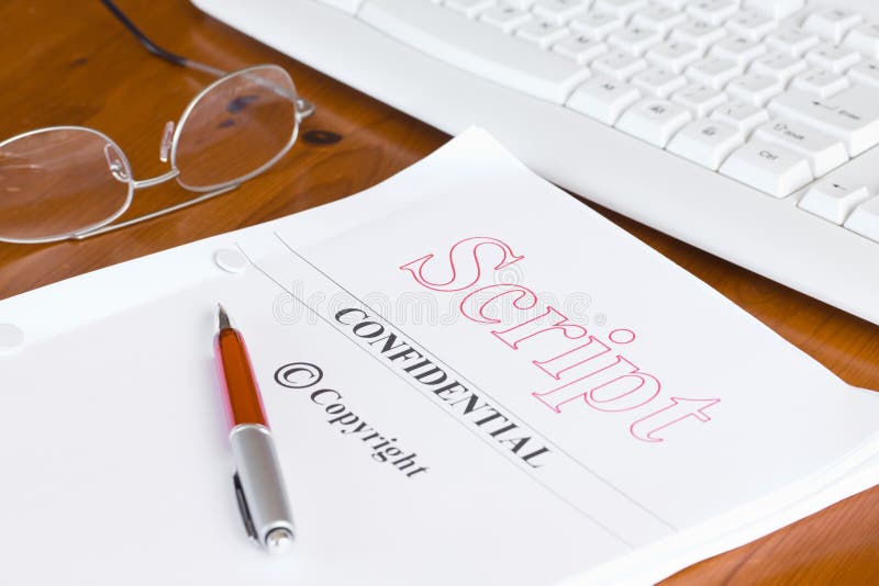 Screenplay manuscript title page on a clean desk with reading glasses and pen