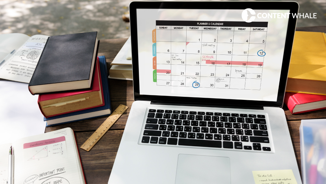 Content planning session with calendar, notebook, and scheduling tools on a desk