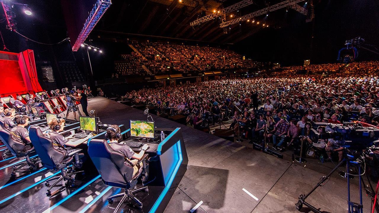 Packed esports arena during a major professional gaming tournament