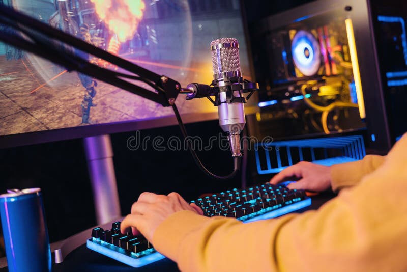Close-up of gamer's hands on professional gaming peripherals during practice