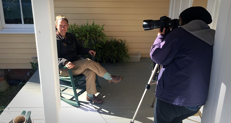 Independent filmmaker shooting with a DSLR camera in an urban location